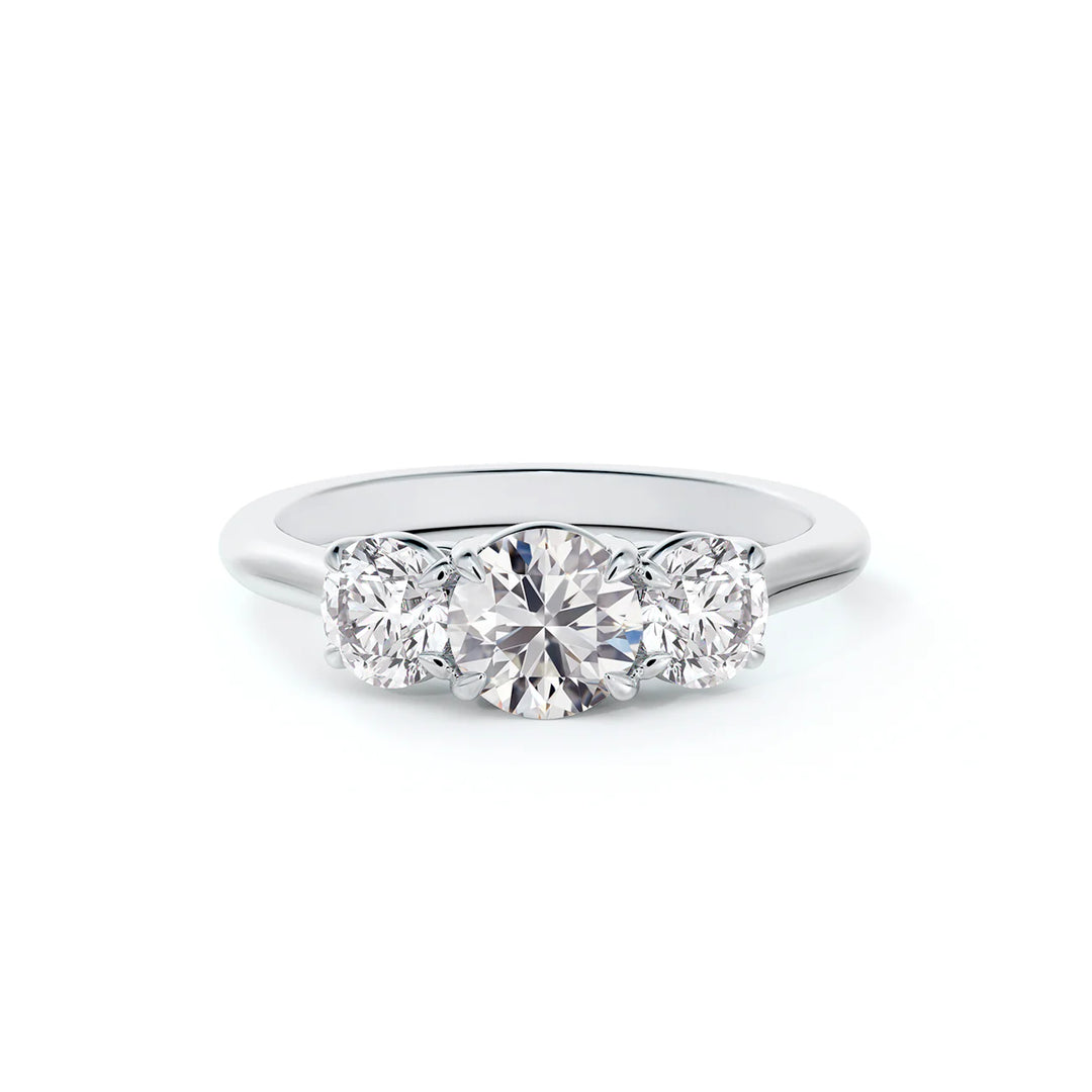 A stunning three-stone diamond engagement ring featuring brilliant cut diamonds set in a delicate band.