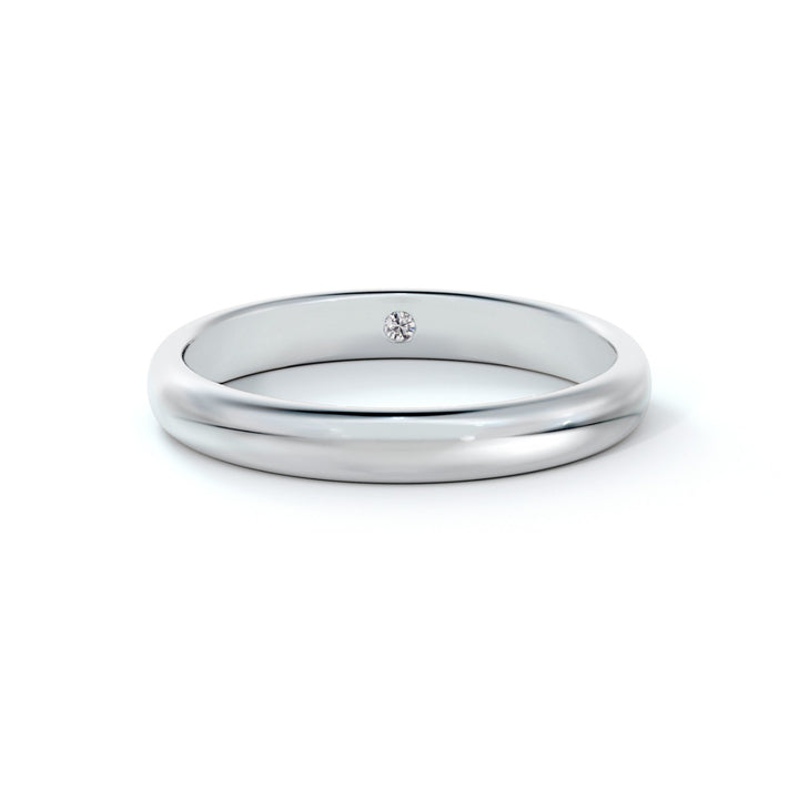 Bague alliance en or blanc 18k sertie d'un diamant caché 0.08 ct