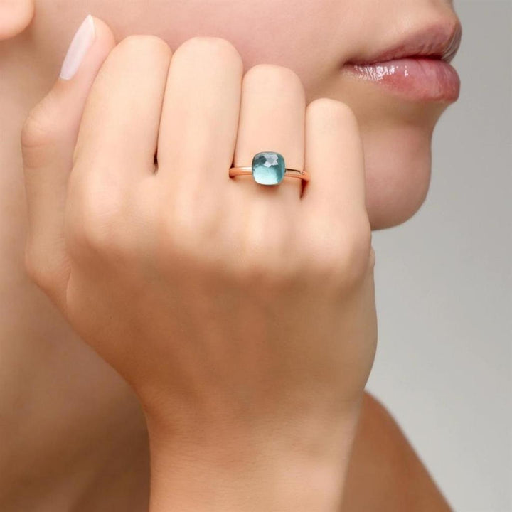 Bague Pomellato Nudo Petit en or rose et or blanc 18k topaze bleu ciel PAB4030-O6000-000OY