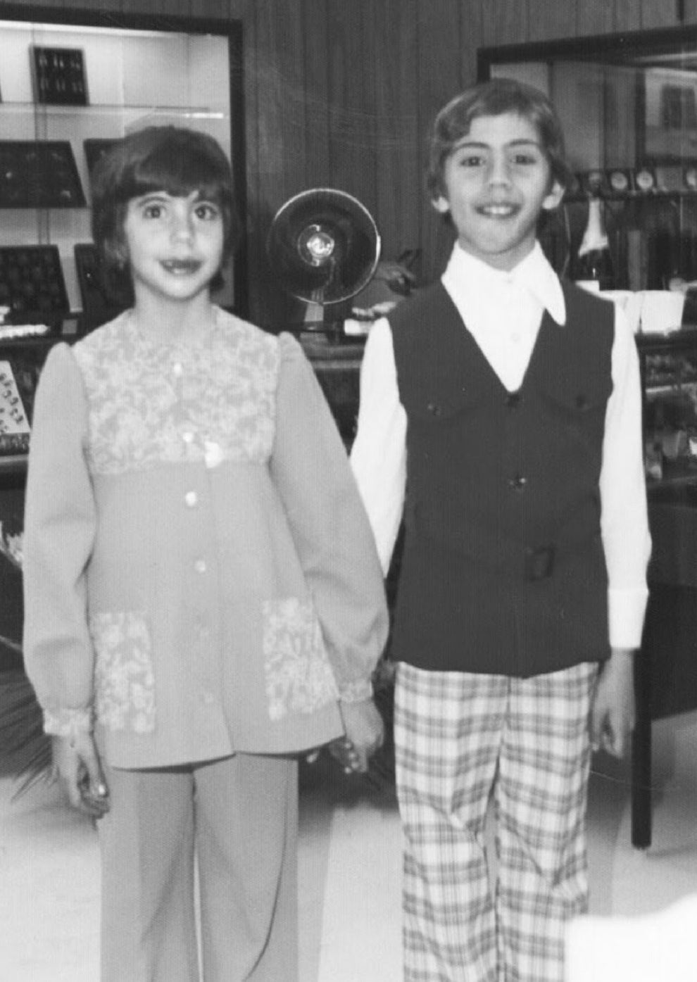 black and white image of children standing next to each other